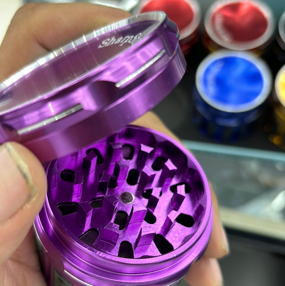 Stardust premium grinder long barrel with plastic grip on sides, sharp stone