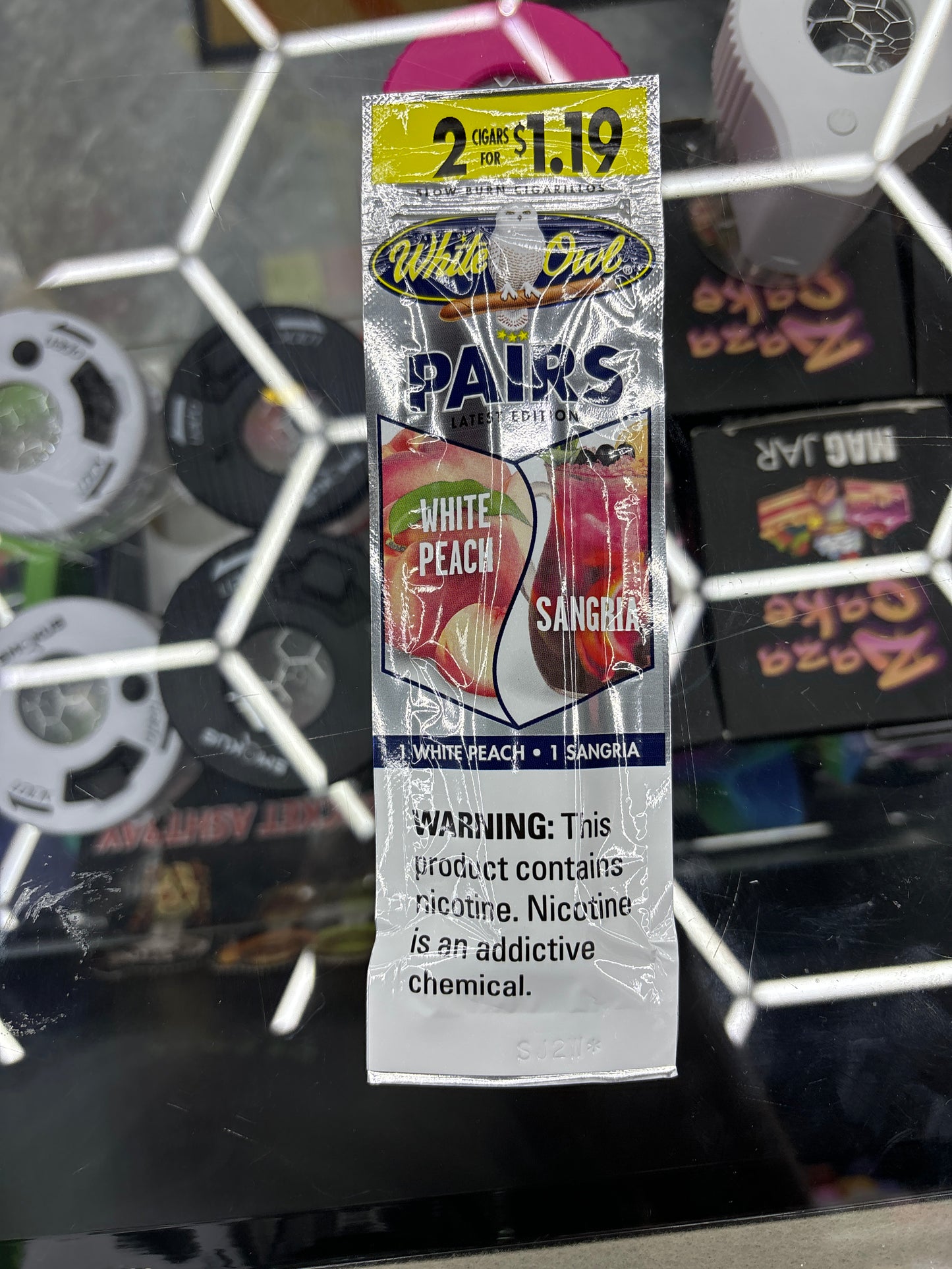 White owl moon pairs white peach, sangria, cigarillos