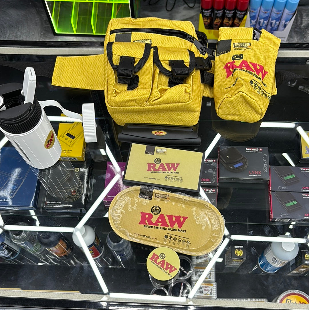 Raw fanny pack. Kit comes with portable water, jug, bong, roller scale, tray, and grinder.