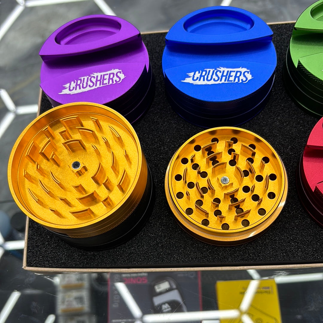 Crushers, grinder, ashtray, and joint paper holder