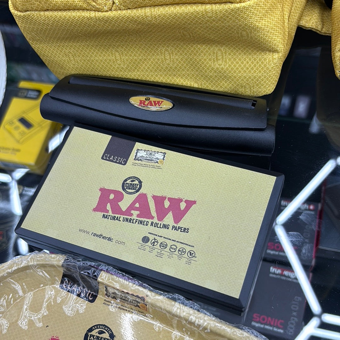 Raw fanny pack. Kit comes with portable water, jug, bong, roller scale, tray, and grinder.